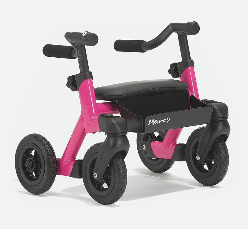 Pinkes Laufrad mit Sitz für Kinder mit Handicap